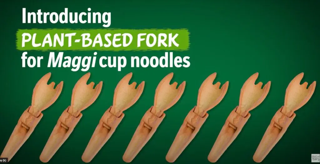 Screenshot of Maggi's short clip, introducing their edible for, showing product images of the same fork side by side on green background. Writing in upper left corner: "Introducing plant-based fork for Maggi cup noodles".